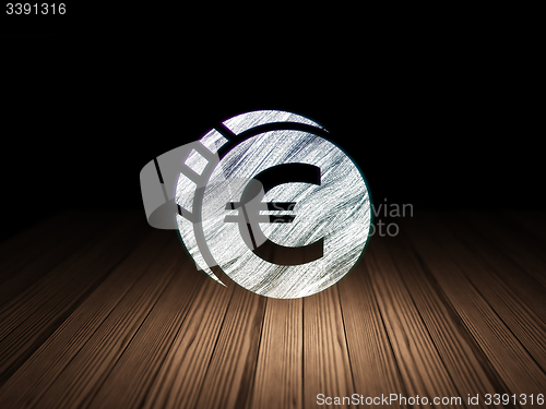 Image of Banking concept: Euro Coin in grunge dark room