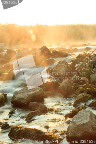 Image of Dawn over Rushing river