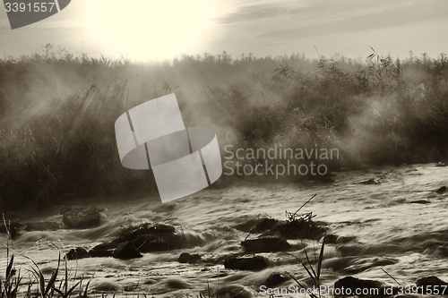 Image of Dawn over Rushing river