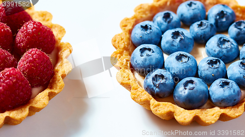 Image of fruit tartlets with raspberries and blueberries 