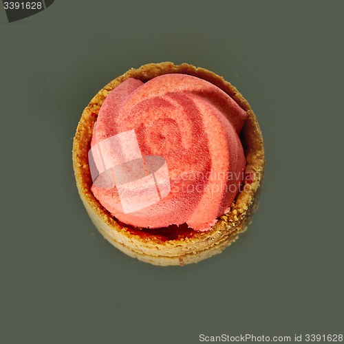 Image of Home made tartlet rose on wooden background. 