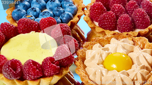 Image of fruit tartlets with raspberries and blueberries 