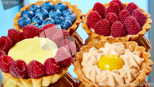 Image of fruit tartlets with raspberries and blueberries 