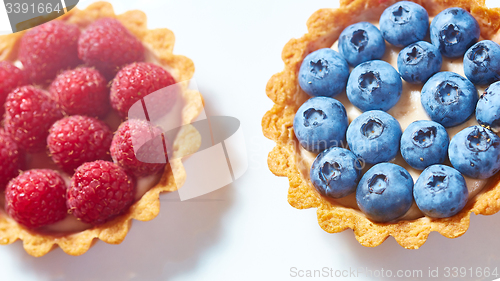 Image of fruit tartlets with raspberries and blueberries 