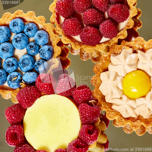 Image of fruit tartlets with raspberries and blueberries 