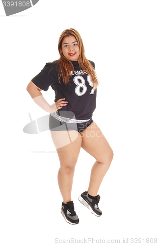 Image of Girl standing in black sports outfit.