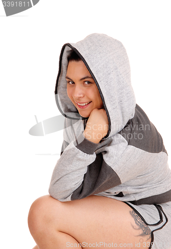Image of Pretty girl in gray hoodie in profile.