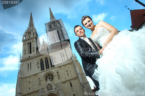 Image of Low angle view of newlyweds 