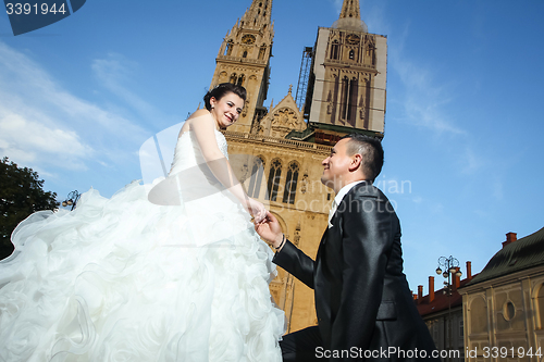 Image of Newlyweds in front of cathedral