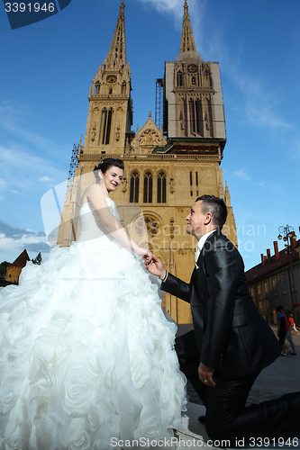 Image of Bride and groom in front of cathedral