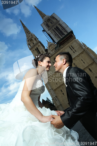 Image of Groom on knees before bride