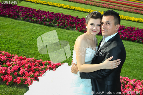 Image of Bride and groom on lawn