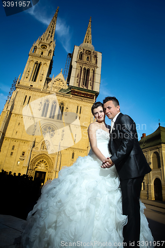 Image of Married couple in front of Cathedral