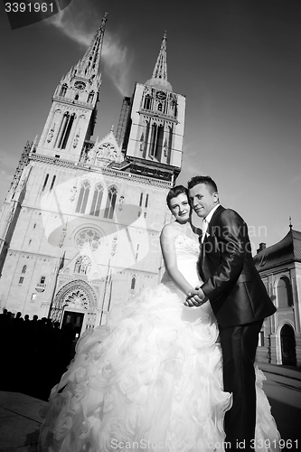 Image of Married couple in front of Cathedral black and white