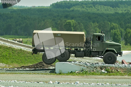 Image of Curtain sided truck comes through on high obstacle