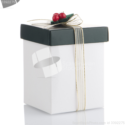 Image of White and green box with gold bow