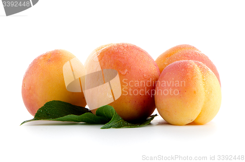 Image of Sweet peaches with leafs