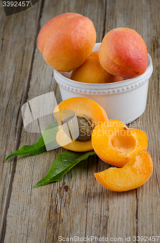 Image of Apricots on wooden table.