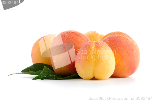 Image of Sweet peaches with leafs