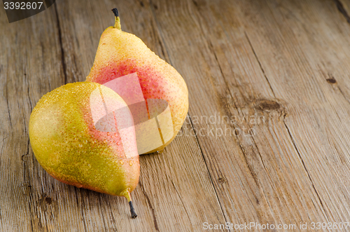 Image of Pears in a old wooden table