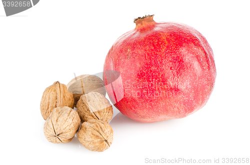 Image of Ripe pomegranate fruit and nuts