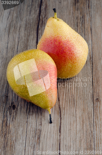 Image of Pears in a old wooden table