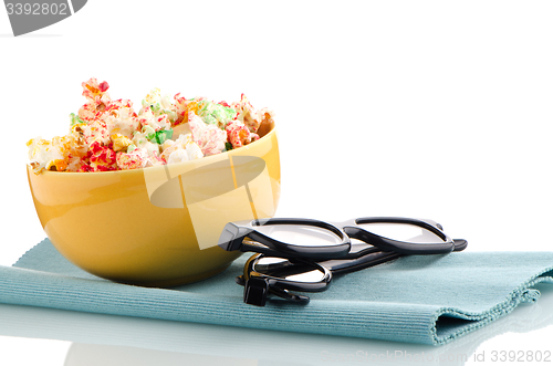 Image of Bowl of popcorn and 3D movie glasses