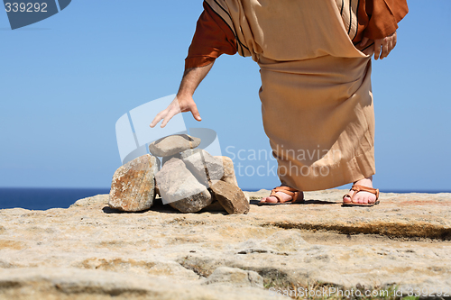 Image of Man by stones  concept Sin Punishment