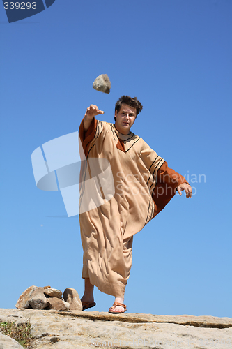 Image of Ancient man throwing stone