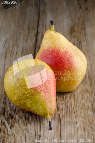 Image of Pears in a old wooden table