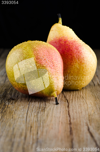 Image of Pears in a old wooden table