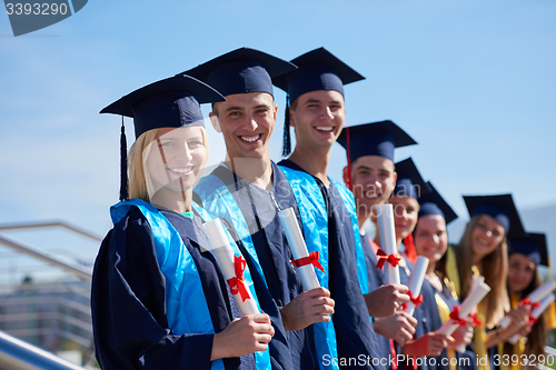 Image of young graduates students group