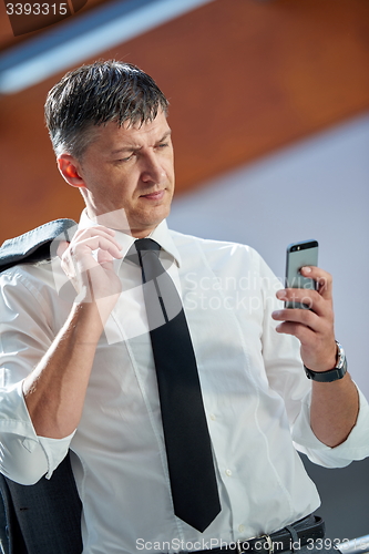 Image of business man using phone