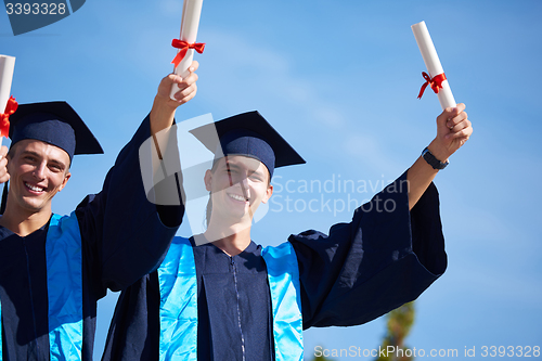 Image of young graduates students group