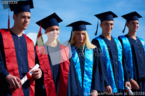 Image of young graduates students group