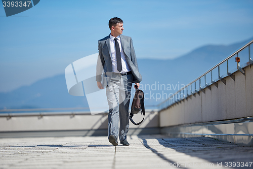 Image of senior  businessman outdoors