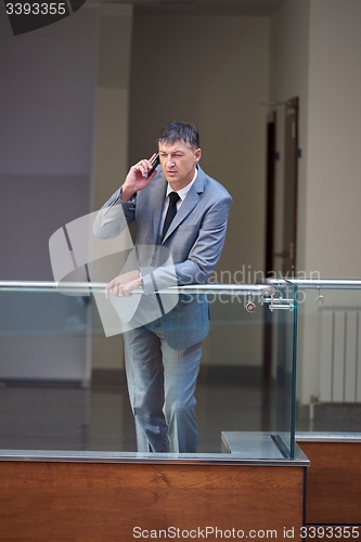 Image of business man using phone