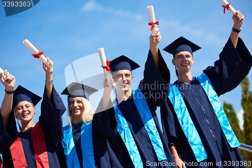 Image of young graduates students group