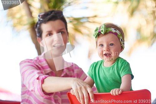 Image of portrait of happy young mother and baby