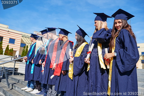 Image of young graduates students group