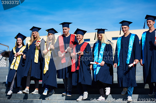 Image of young graduates students group