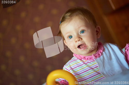 Image of baby playing with toys at home