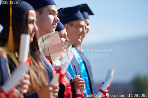 Image of young graduates students group