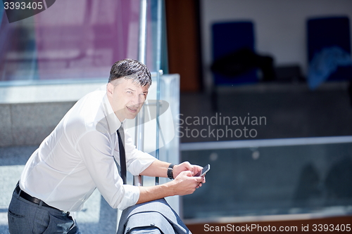 Image of business man using phone