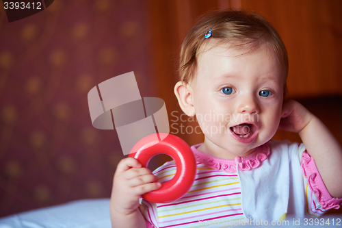 Image of baby playing with toys at home