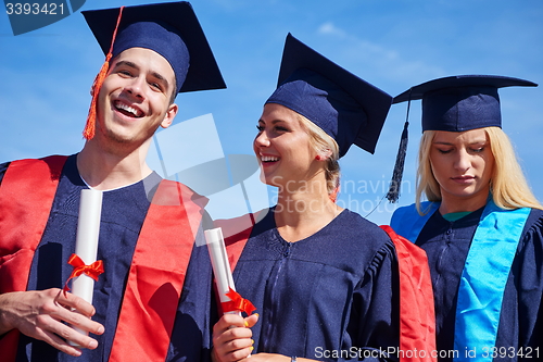 Image of young graduates students group