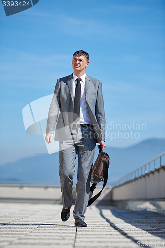 Image of senior  businessman outdoors