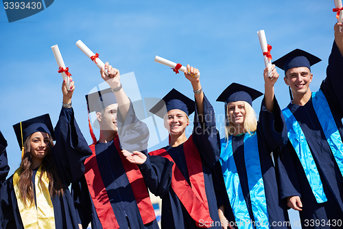 Image of young graduates students group