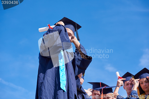 Image of young graduates students group