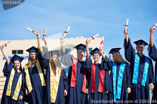 Image of young graduates students group